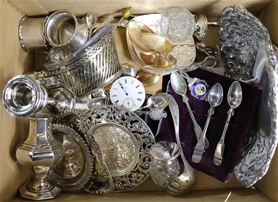 A Victorian repousse silver dish and a quantity of silver and other items including candlestick, caster and spoons.